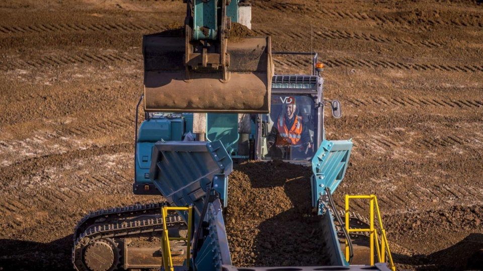 VDQ excavator loading substrate onto belt