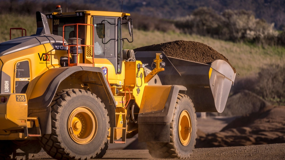VDQ Loader with bucket full of soil